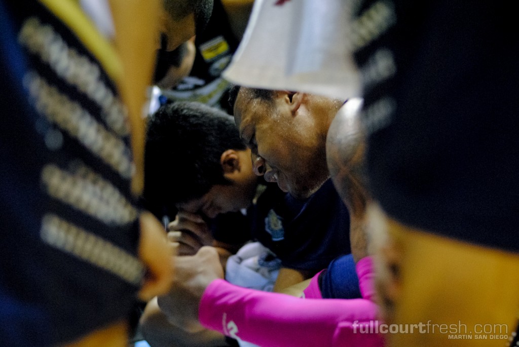 As the buzzer signalled the Bulldogs' win against the then-undefeated Tamaraws, NU star Parks lead his team to the center of the court and in to a prayer huddle. Martin San Diego | FCF