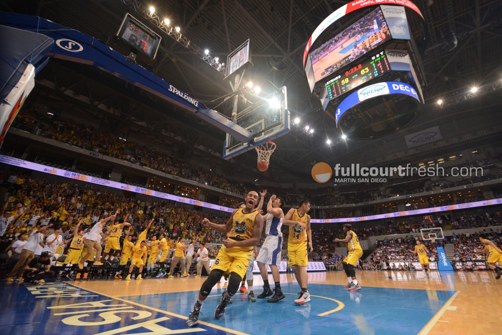 Sheak Sheriff celebrates his game-sealing lay-up against Ateneo de Manila as the ball goes in giving University of Santo Tomas a 7-point cushion with 23.8 seconds remaining in regulation. The Growling Tigers went on to steal its fourth ‪#‎UAAP78‬ win from the Blue Eagles, 68-58.