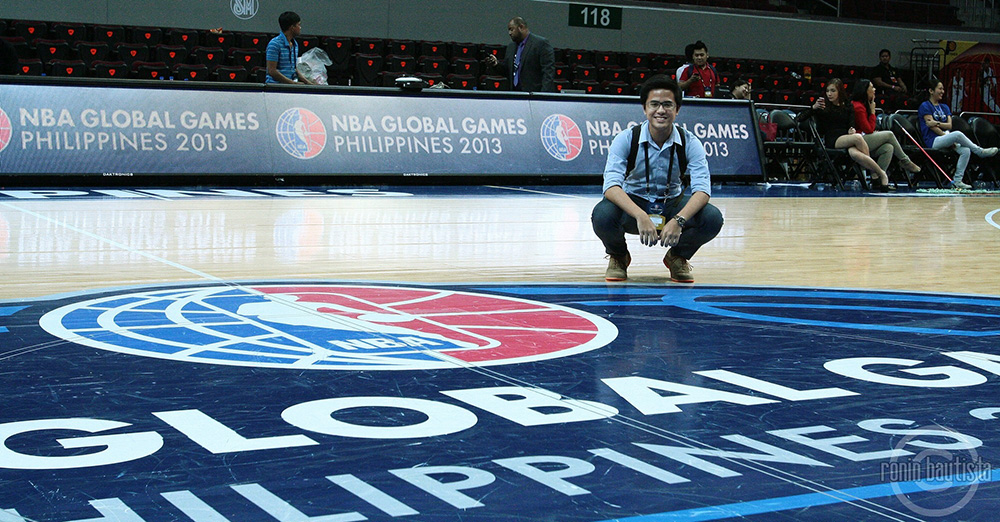 Job de Leon is still within courtside's reach, as he covers collegiate and professional basketball for GMA News Online. Here, he poses for a souvenir photo at the NBA Global Games held in the Philippines. Photo by Ronin Bautista